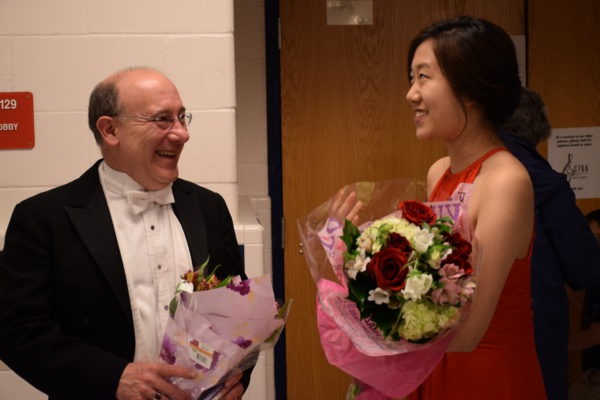 City of Fairfax Band Music Director Bob Pouliot congratulates Young Artist Competition Winner Olivia Johann