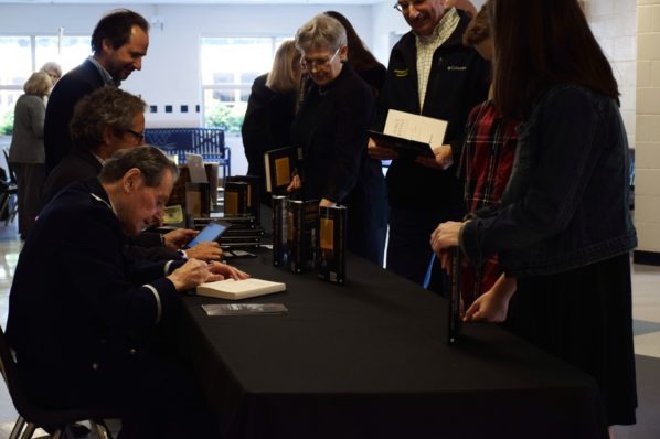 Col. Gabriel (ret.) signing copies of his book "The Force of Destiny"